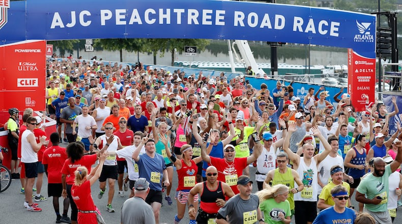 Racers begin at the starting line from Lenox Square during the 47th running of the AJC Peachtree Road Race Monday July 4, 2016, in Atlanta.