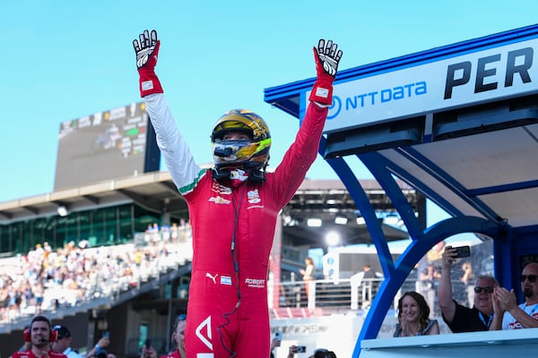 Robert Shwartzman, of Israel, celebrates after winning the pole position during qualifications for the Indianapolis 500 auto race at Indianapolis Motor Speedway in Indianapolis, Sunday, May 18, 2025. (AP Photo/Michael Conroy)