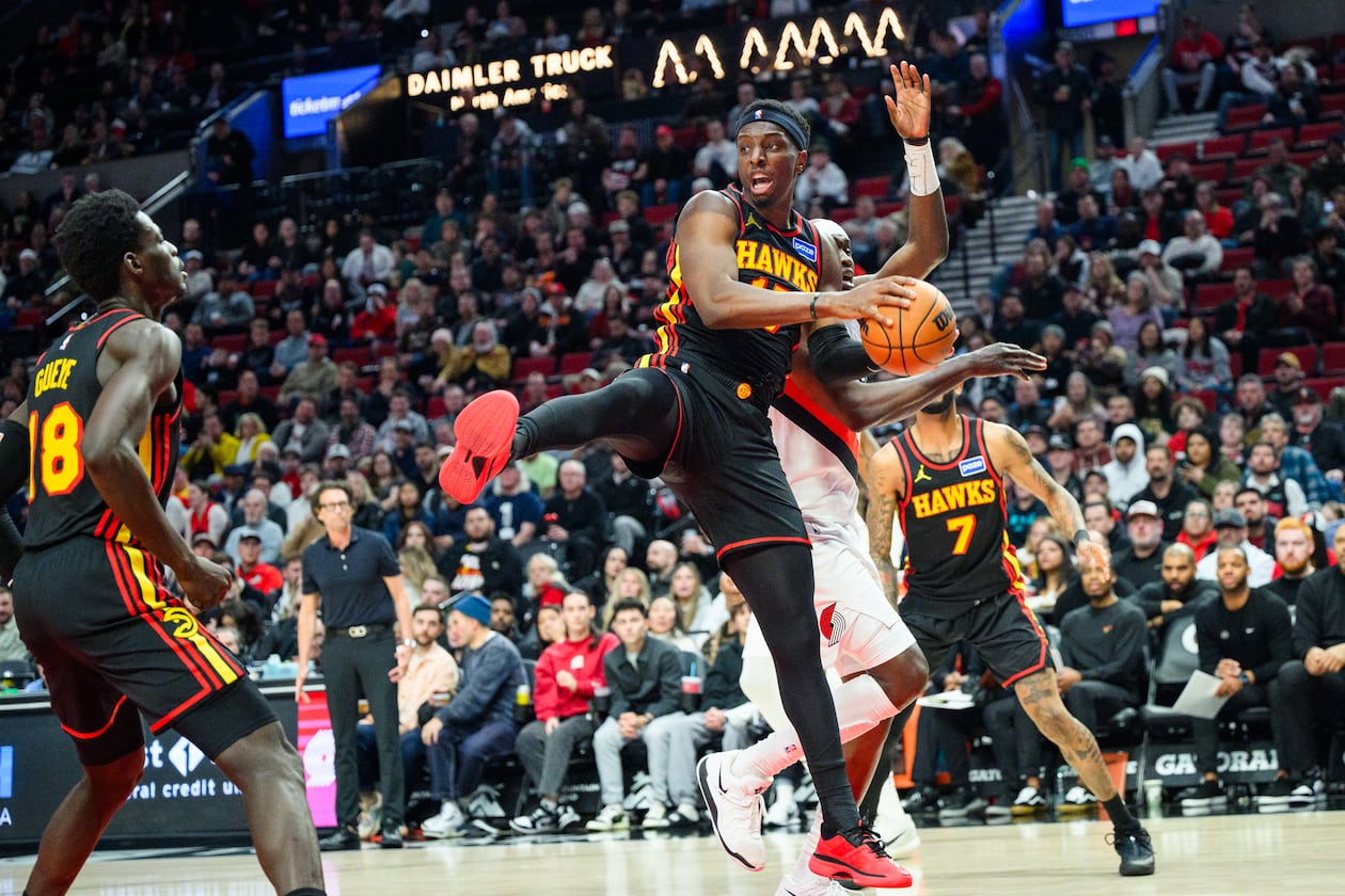 Atlanta Hawks forward/center Onyeka Okongwu, center, comes down with a rebound during the second half of an NBA basketball game against the Portland Trail Blazers on Thursday, Jan. 15, 2026, in Portland, Ore. (Molly J. Smith/AP)