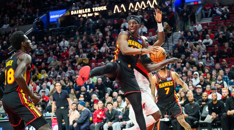 Atlanta Hawks forward/center Onyeka Okongwu, center, comes down with a rebound during the second half of an NBA basketball game against the Portland Trail Blazers on Thursday, Jan. 15, 2026, in Portland, Ore. (Molly J. Smith/AP)