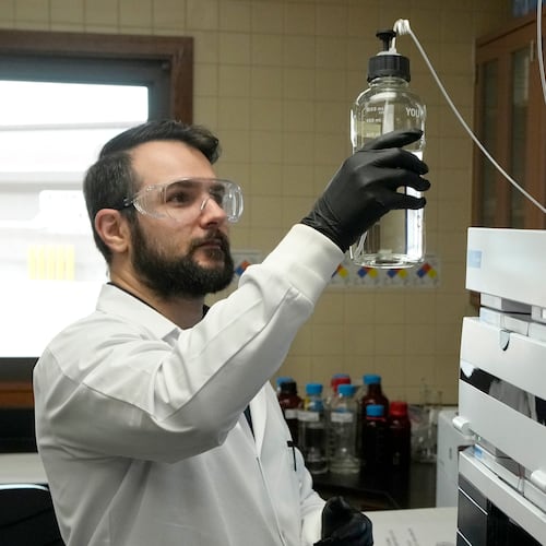 Michael Serpa, senior scientist at the Scottsdale Water Campus, works on water testing, Wednesday, Sept. 9, 2026, in Scottsdale, Ariz. (AP Photo/Ross D. Franklin)