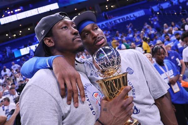 Oklahoma City Thunder forward Jalen Williams (8), left, and Oklahoma City Thunder guard Shai Gilgeous-Alexander (2) pose for a photo after Game 5 of the Western Conference finals of the NBA basketball playoffs against the Minnesota Timberwolves, Wednesday, May 28, 2025, in Oklahoma City. (AP Photo/Nate Billings)
