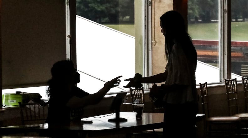Voters cast ballots at Park Tavern in Fulton County as primary election day got underway in Georgia on Monday, May 25, 2022. (John Spink / John.Spink@ajc.com)