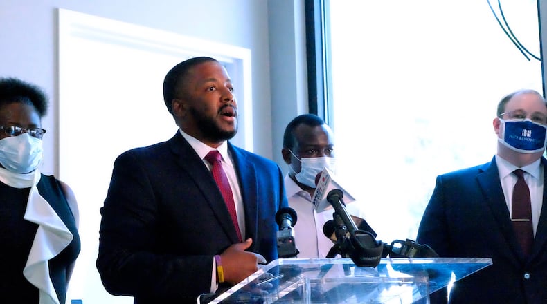 Marc Brown, who is representing Sir Brandon Legette in a lawsuit against the Columbia Police Department, talks to reporters Friday. Legette filed a complaint in federal court alleging the officer, Sean Rollins, used unjustified force when he shot Legette near a grocery store parking lot Aug. 24.