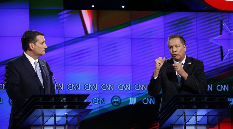 Ted Cruz listens as John Kasich speaks during the Republican presidential debate in Miami, March 10. They'll be pulling their punches against each other, and focusing their attacks on Donald Trump, in three of the remaining states. (AP Photo / Wilfredo Lee)