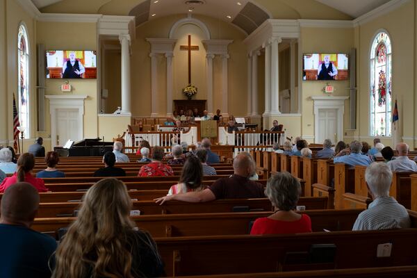 The Rev. Dr. Geoff Murphy, senior pastor at Winder First United Methodist Church, who was out of town, delivers a video message to his congregation about the Apalachee High School shootings during service Sunday, Sept. 8, 2024. Ben Gray for the Atlanta Journal-Constitution
