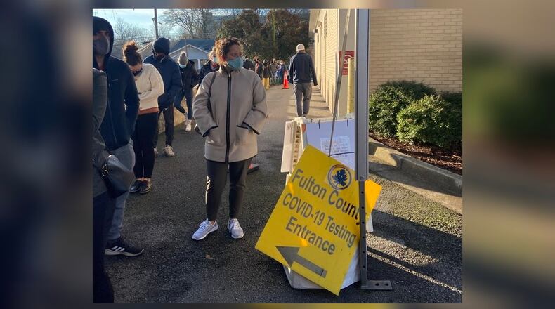 More than 100 people were in line Wednesday morning at Fulton County's COVID-19 testing site off Boulevard.