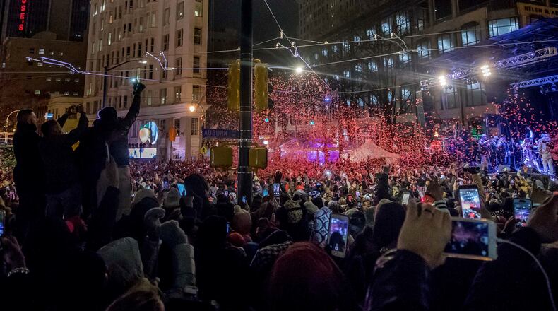 People brought in 2018 with the Peach Drop at Woodruff Park.