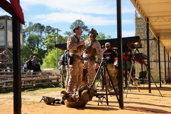 Marine Corps Staff Sgt. Tyler Johnson (center left) stands after competing in the International Sniper Competition at Fort Benning near Columbus on April 8, 2026. (Arvin Temkar/AJC)