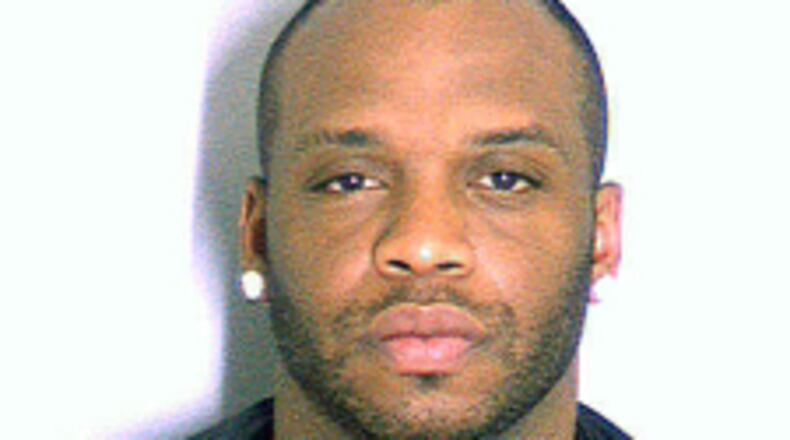 This undated photo provided by the Dekalb County Police, Tuesday, July 29, 2014, shows Arizona Cardinals NFL football player John Abraham. Authorities say the former Atlanta Falcons player, who has been absent from the Arizona Cardinals training camp since Friday, was arrested a month ago in suburban Atlanta. The jail records state that Abraham was charged with driving under the influence involving alcohol; and stopping, standing or parking in a prohibited place. (AP Photo/Dekalb County Police)