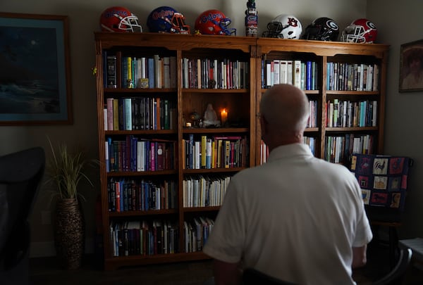 Philip McLemore, A former Latter-day Saints Air Force and hospice chaplain, sits facing a shrine he uses in his yoga and meditation practice, at his home in Eagle Mountain, Utah, on Thursday, April 24, 2025. (AP Photo/Jessie Wardarski)
