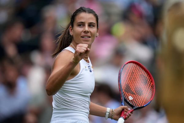 Emma Navarro of the U.S. celebrates winning the women's singles third round match against Barbora Krejcikova of Czech Republic at the Wimbledon Tennis Championships in London, Saturday, July 5, 2025.(AP Photo/Alastair Grant)