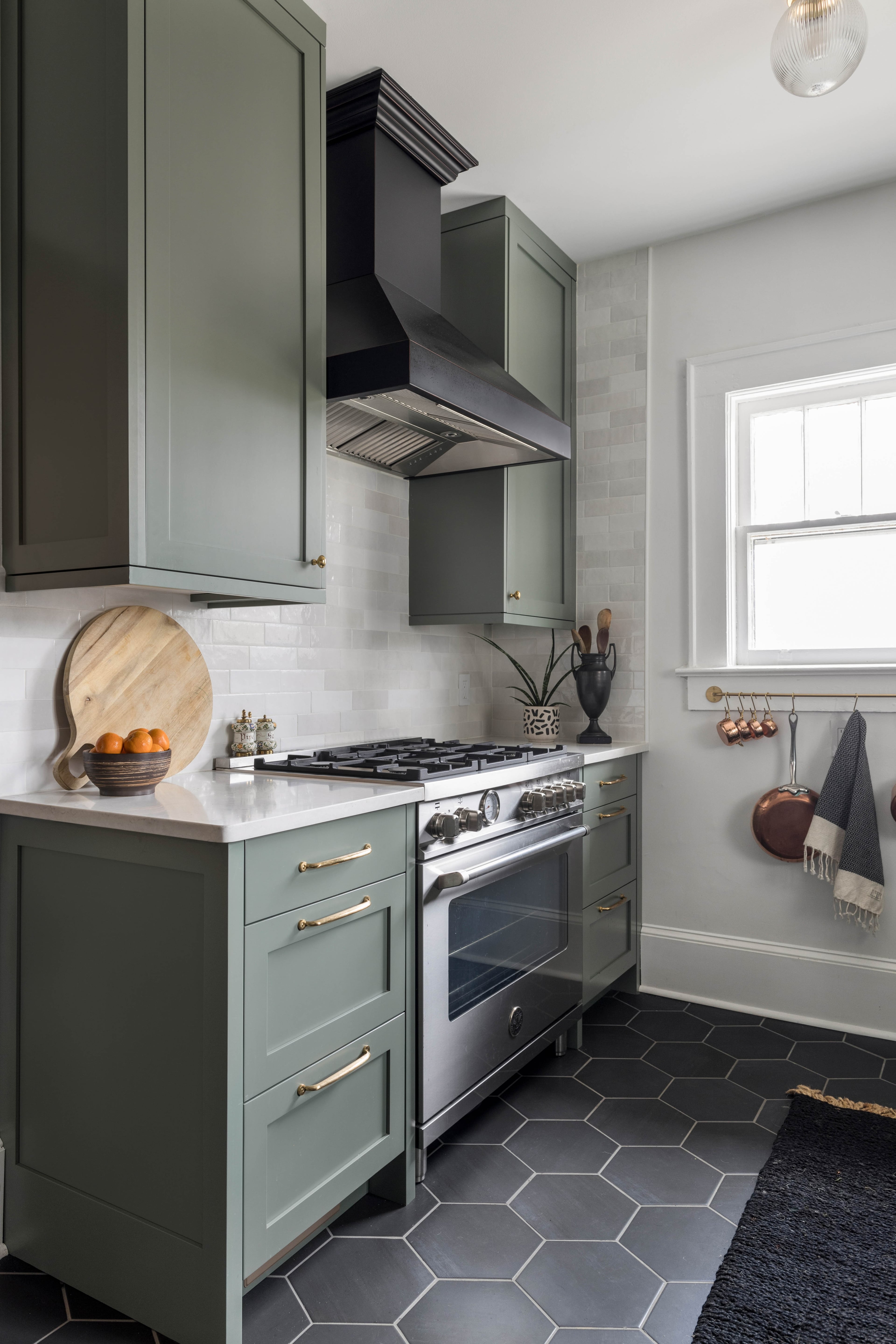 Professional hood systems and metal rails for hanging pots are two elements of professional kitchens that are showing up in home renovations. (Courtesy of Silo Studios/Tomas Espinoza)