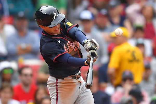 Atlanta Braves' Nick Allen hits a sacrifice fly, allowing Ozzie Albies to score, in the fifth inning of a baseball game against the Boston Red Sox, Sunday, May 18, 2025, in Boston. (AP Photo/Steven Senne)