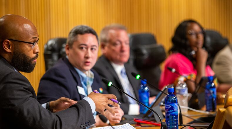 The Gwinnett County Board of Commissioners, shown at a board meeting Tuesday, June 15, 2021, looks a lot different than it did just a few years ago. County Commissioner Kirkland Carden (left) is one of the critics of a surprise GOP push to double the size of the Gwinnett county commission. (Jenni Girtman for The Atlanta Journal-Constitution)