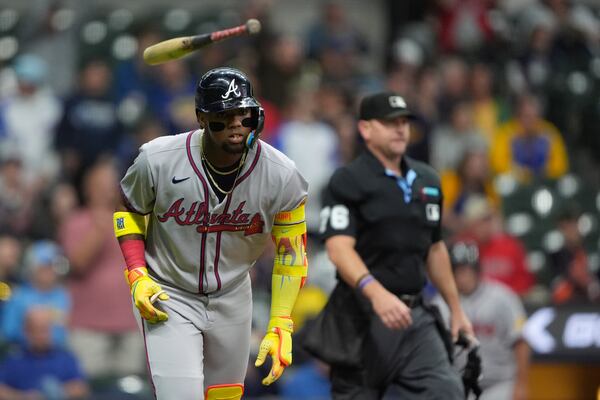 Braves outfielder Ronald Acuña Jr. flips his bat after hitting a solo home run during Monday's game in Milwaukee.