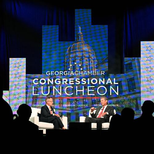Gov. Brian Kemp (right) speaks during the Georgia Chamber of Commerce's annual congressional luncheon in Athens on Wednesday. (Hyosub Shin/AJC)