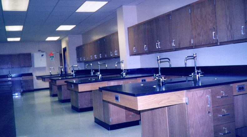 A former paraprofessional at Lassiter High, was cited for alcohol possession after officials said she was under the influence at work.