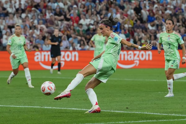Italy's Barbara Bonansea scores her side's opening goal during the Women's Euro 2025 semifinals soccer match between England and Italy at Stade de Geneve in Geneva, Switzerland, Tuesday, July 22, 2025. (AP Photo/Martin Meissner)