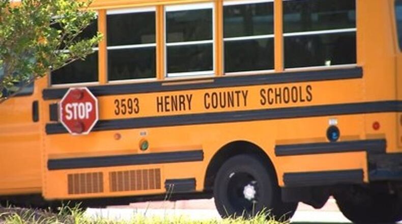 Henry County Schools is relaxing some COVID-19 restrictions after infection numbers decline. AJC file photo