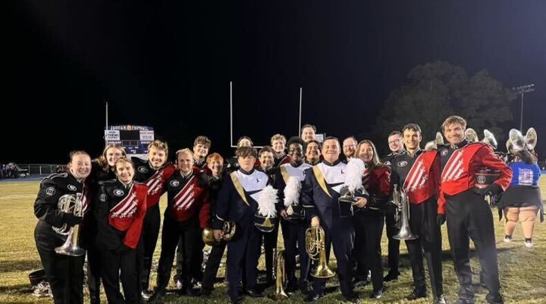 Baritone horn players from Apalachee High School marching band and University of Georgia Redcoats gathered together to share traditions, a dance circle and advice.