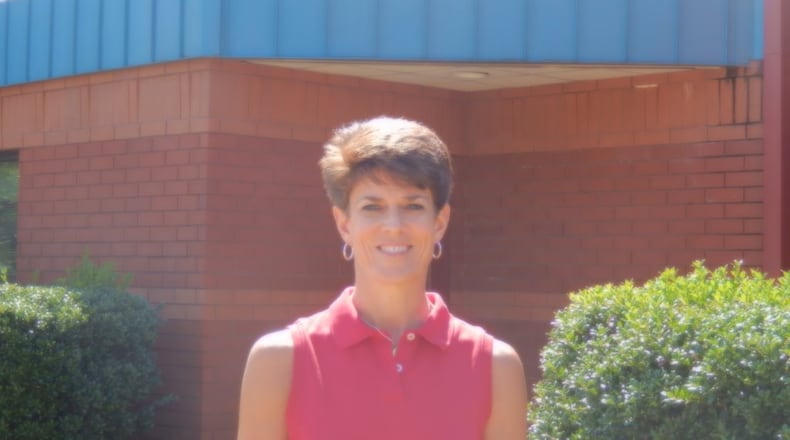 Emily Adams poses for a picture. She is a physical education teacher at Kennesaw Elementary School and recently won a statewide award.