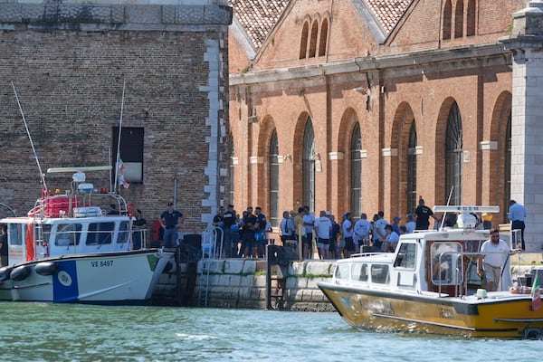Security gather in front of the Venice Arsenale in Venice, Italy, Saturday, June 28, 2025. (AP Photo/Luca Bruno)