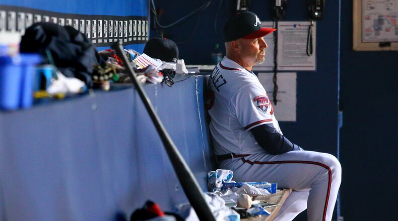 092514 Atlanta: Braves manager Fredi Gonzalez watches from the dugout as the Braves fall behind the Pirates 10-0 during the eight inning in a baseball game on Thursday, Sept. 25, 2014, in Atlanta. CURTIS COMPTON / CCOMPTON@AJC.COM Fredi Gonzalez watched the Braves spiral down the stretch again. (Curtis Compton, AJC)