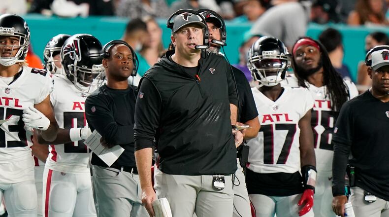 Falcons coach Arthur Smith looks at his team from the sidelines against the Miami Dolphins, Saturday, Aug. 21, 2021, in Miami Gardens, Fla. (AP Photo/Wilfredo Lee)