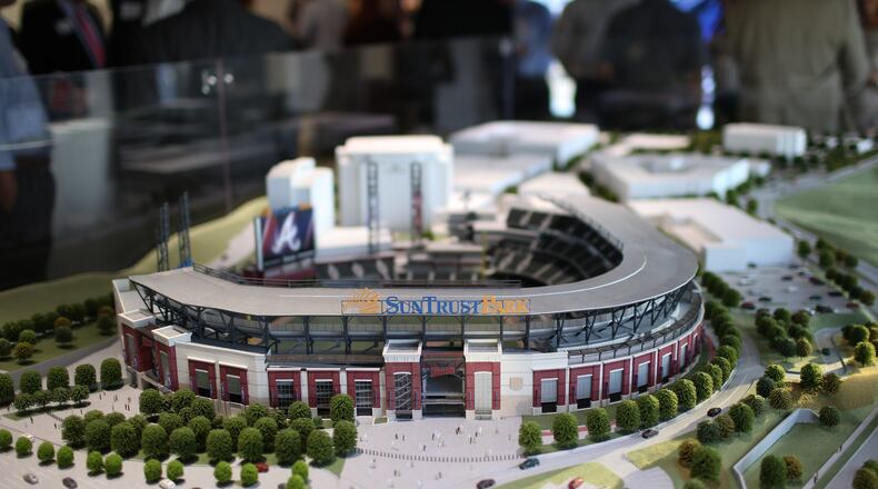 A scale model of the new Braves stadium sits on display as people gather for a meeting about future plans for transit in Cobb at the SunTrust Park Preview Center, Thursday, Oct. 20, 2016, in Atlanta. BRANDEN CAMP/SPECIAL