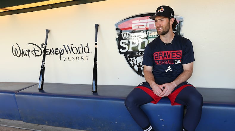 Braves infielder Charlie Culberson sits in the dugout with his bats before starting team practice  Wednesday, Feb 21, 2018, at the ESPN Wide World of Sports Complex in Lake Buena Vista.