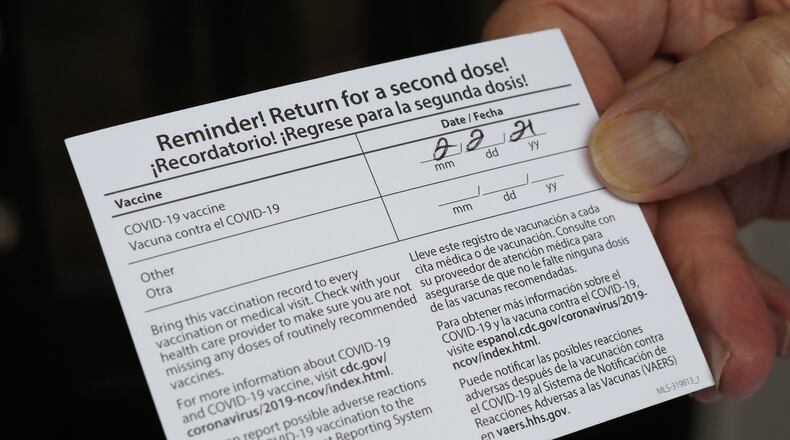 Getting the COVID-19 vaccination is no small feat. As such, many who have met the requirements or lucked out in some other way to be inoculated from the deadly virus have felt compelled to share their vaccination updates on social media. (Curtis Compton / Atlanta Journal-Constitution)