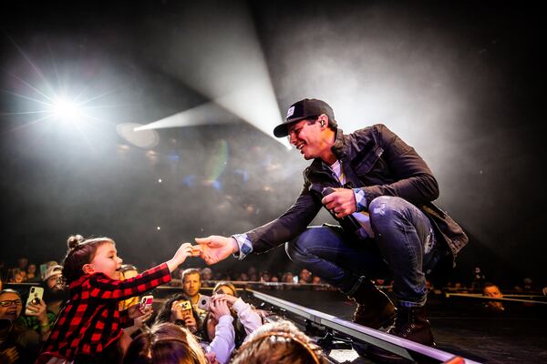 Granger Smith shares a moment with a young fan at Infinite Energy Arena.