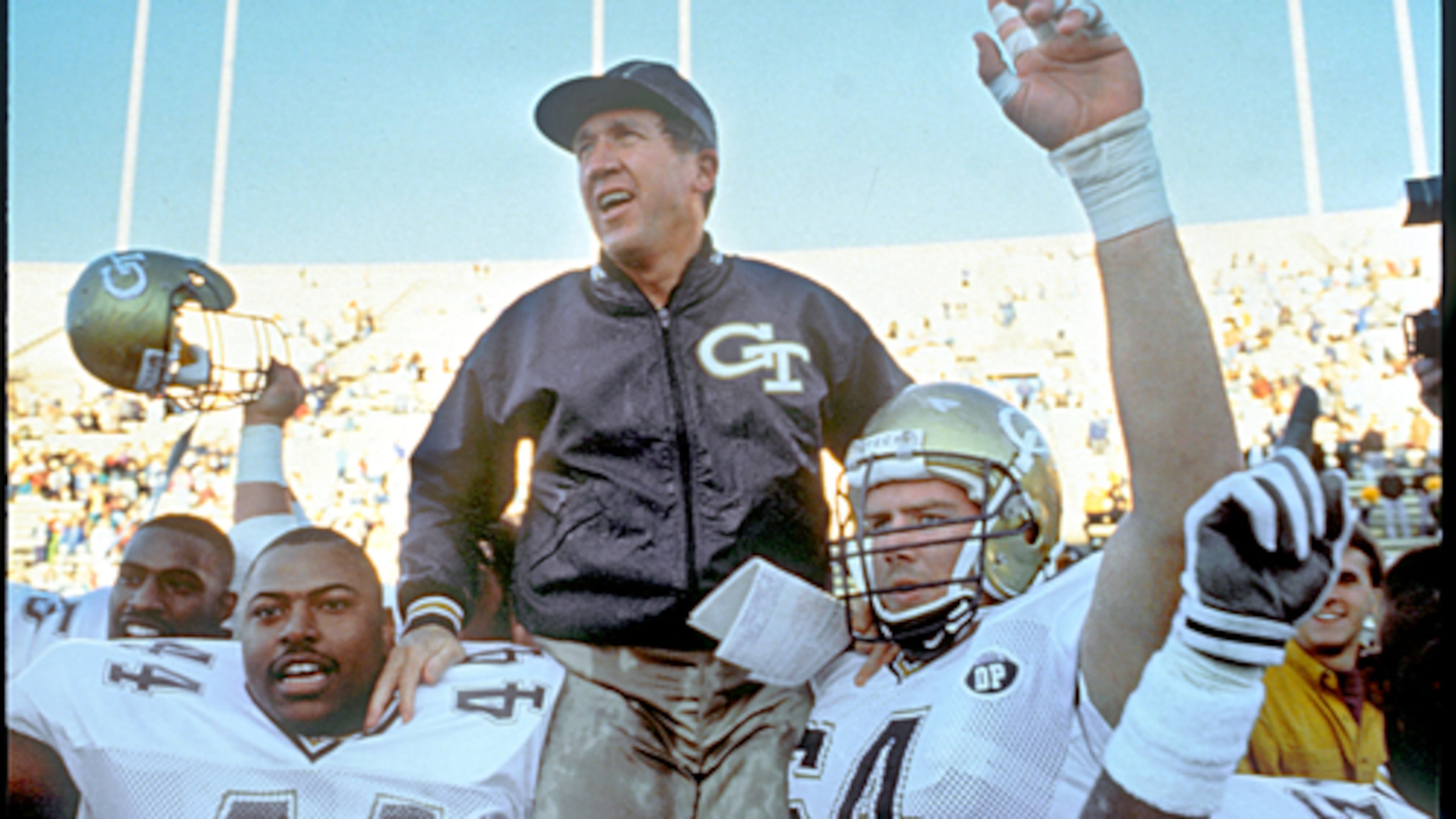 Coach Bobby Ross (on shoulders) rebuilt the Yellow Jackets after just five wins over his first two seasons (1987-88). Georgia Tech entered the 1990 season unranked but finished as the only undefeated team in Division I-A college football and shared the national title with Colorado. (Courtesy of Georgia Tech Athletics)