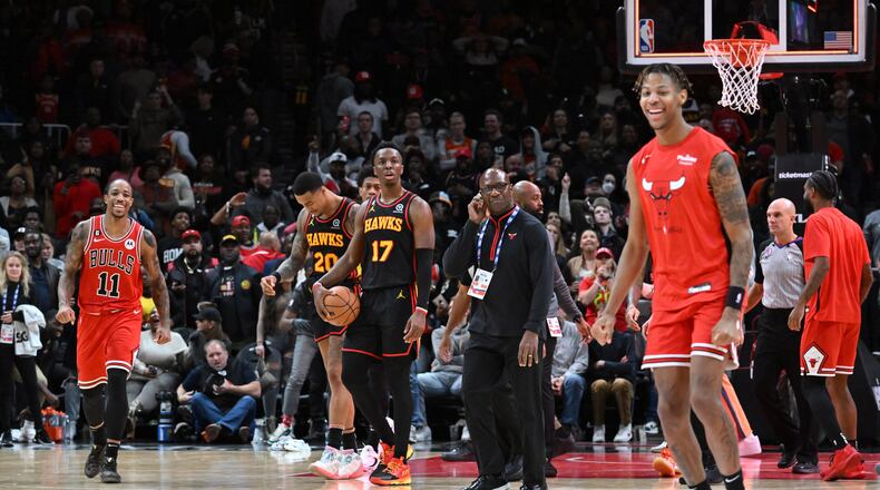 Hawks players react as Chicago Bulls players celebrate their win at the end of the fourth quarter in an NBA basketball game at State Farm Arena on Wednesday, December 21, 2022. (Hyosub Shin / Hyosub.Shin@ajc.com)