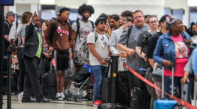 June 29, 2023 Atlanta: Travelers came ready to fly on Friday, June 29, 2023 and was a busy day for security queues at Hartsfield-Jackson International Airport. More than 103,000 departing passengers were expected to pass through TSA checkpoints surpassing the record set on the Monday after the Super Bowl in Atlanta in 2019, said Robert Spinden, TSA’s federal security director in Atlanta. (John Spink / John.Spink@ajc.com)