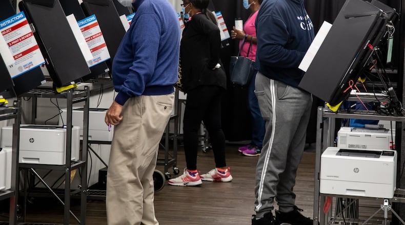 People cast their vote at a Cobb County polling center on Whitlock Ave in Marietta, October 12, 2020.   STEVE SCHAEFER / SPECIAL TO THE AJC