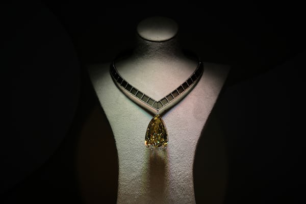 A 303.10 carat pear-shaped Fancy Deep Brownish Yellow Diamond is on display during an exhibition in Abu Dhabi, United Arab Emirates, Tuesday, April 8, 2025. (AP Photo/Altaf Qadri)