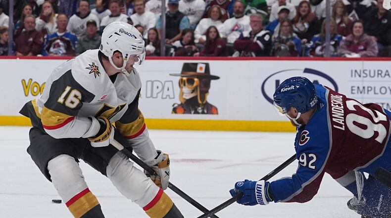 Colorado Avalanche left wing Gabriel Landeskog, right, blocks the shot by Vegas Golden Knights right wing Pavel Dorofeyev during the second period in Game 1 of the Western Conference finals NHL hockey Stanley Cup playoff series Wednesday, May 20, 2026, in Denver. (AP Photo/David Zalubowski)