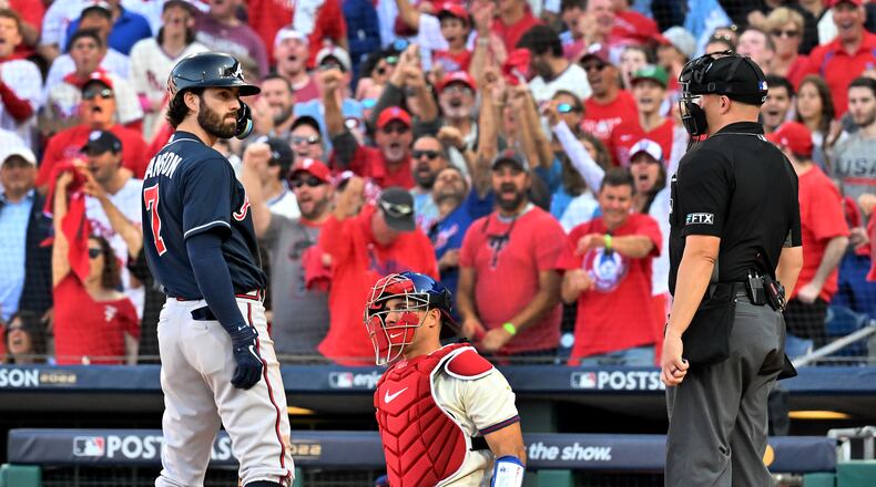 Braves shortstop Dansby Swanson strikes out during the sixth inning in Game 4 of the National League Division Series on Saturday at Citizens Bank Park in Philadelphia. (Hyosub Shin / Hyosub.Shin@ajc.com)