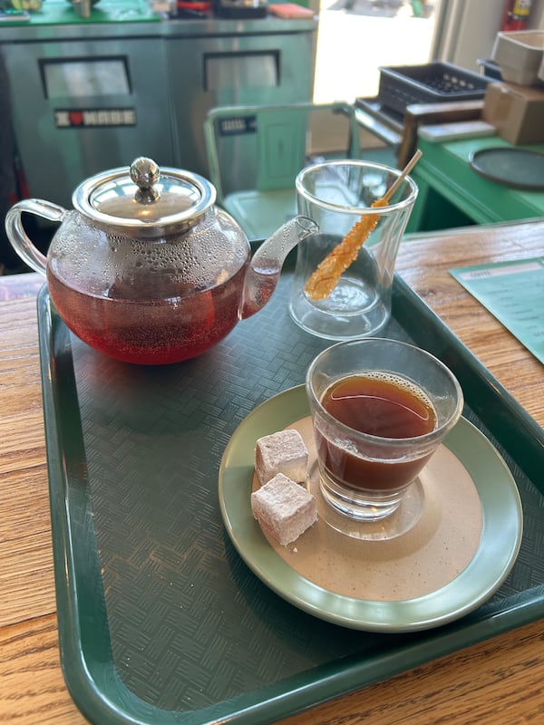A pot of tea and a Turkish coffee with two Turkish delights are on the menu at Sassy's Cafe in the CreateATL space. (Olivia Wakim/AJC)