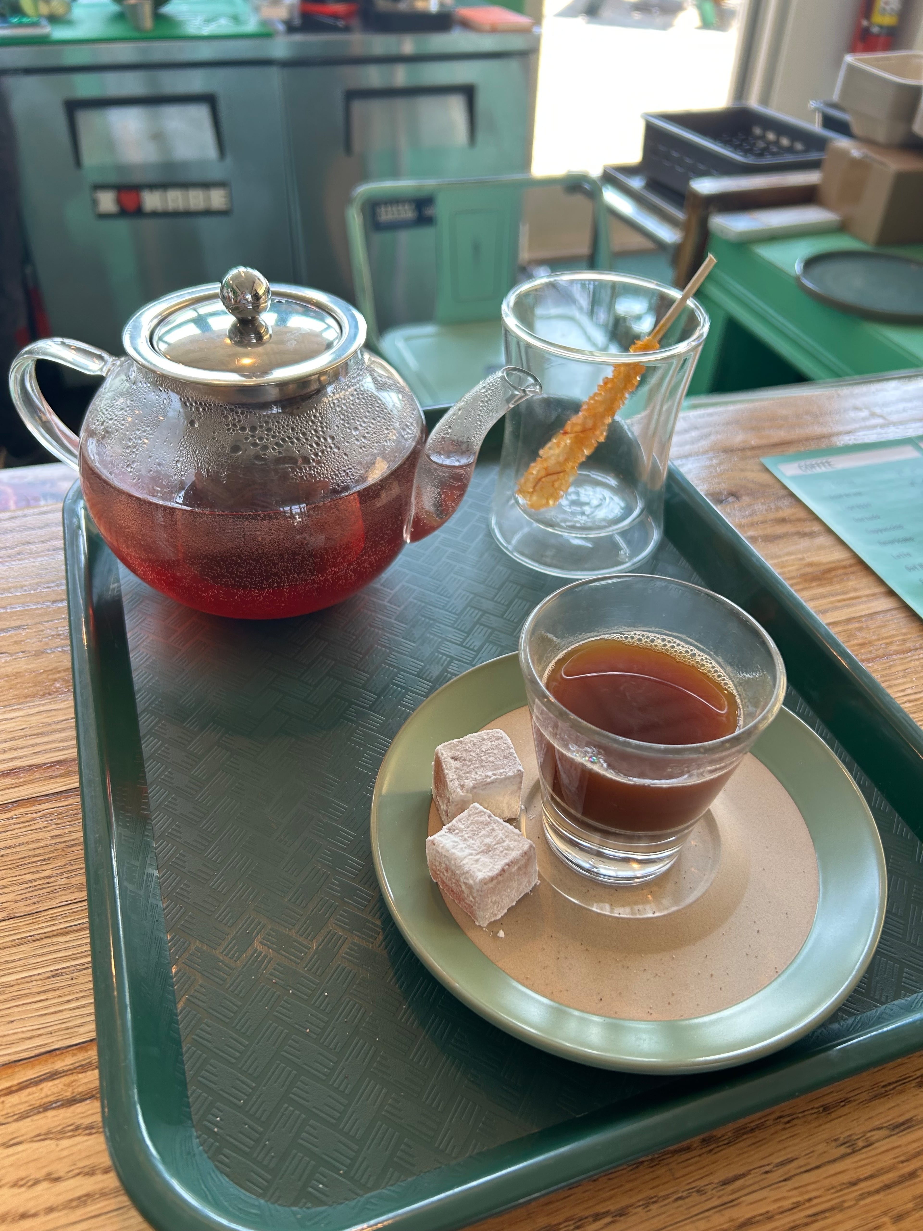 A pot of tea and a Turkish coffee with two Turkish delights are on the menu at Sassy's Cafe in the CreateATL space. (Olivia Wakim/AJC)