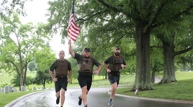 Shepherd's Men members (l-r) Walter Marques, James Peterson and Travis Ellis run to raise money to support veterans at the Shepherd Center.