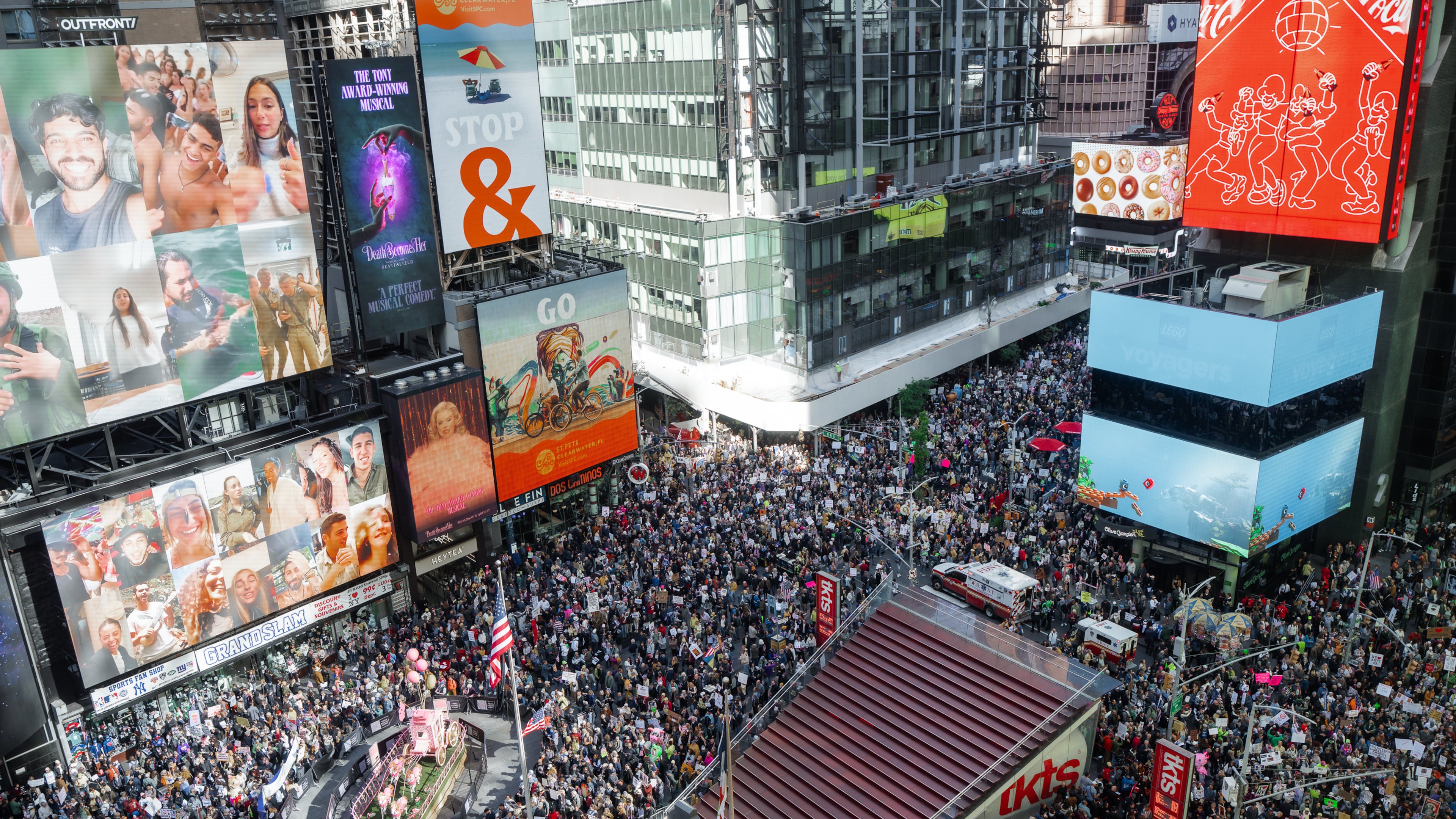 Thousands of protesters fill Times Square during a "No Kings" protest Saturday, Oct. 18, 2025, in New York. (AP Photo/Olga Fedorova)
