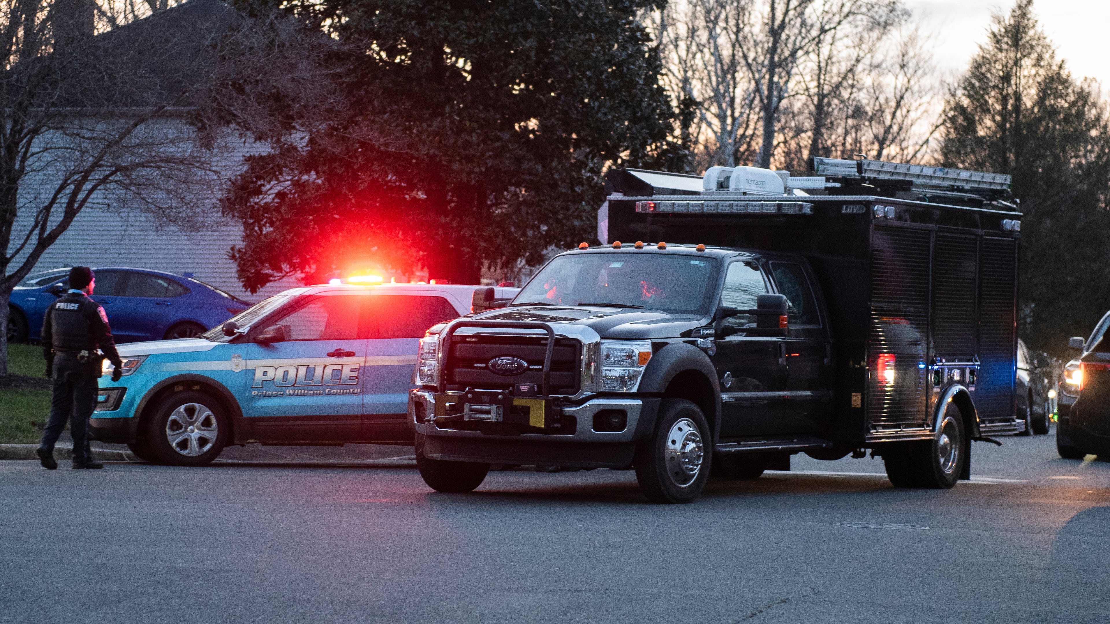 An FBI truck departs the street where the FBI made an arrest and are investigating a house in Woodbridge, Va., Thursday, Dec. 4, 2025. (AP Photo/Cliff Owen)