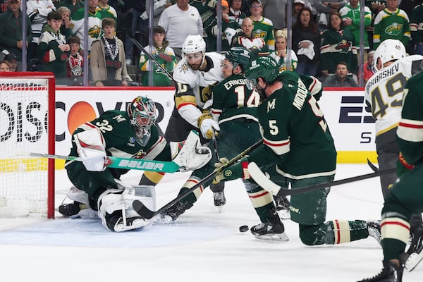 Vegas Golden Knights center Ivan Barbashev (49) skates in to shoot a rebound in for the winning goal against the Minnesota Wild during overtime in Game 4 of an NHL hockey Stanley Cup first-round playoff series, Saturday, April 26, 2025, in St. Paul, Minn. (AP Photo/Stacy Bengs)