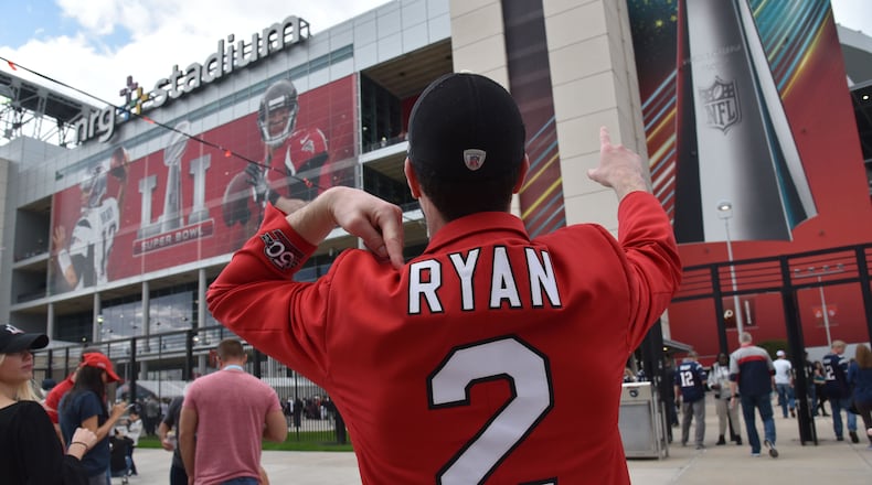 Houston, Texas: Atlanta Falcons fan rallies outside the NRG Stadium on Sunday. Hyosub Shin, hshin@ajc.com