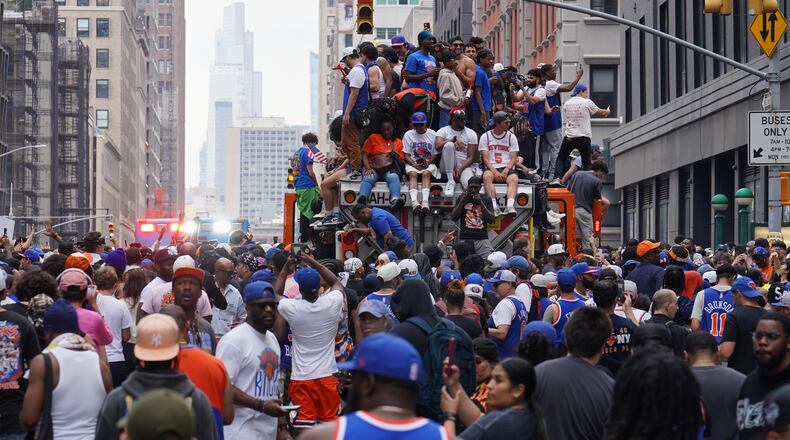 Fans celebrate during the New York Knicks' NBA championship parade Thursday, June 18, 2026, in New York. (AP Photo/Ryan Murphy)