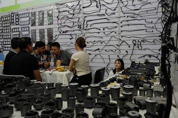 Vendors talk to buyers at the 137th Canton Fair in Guangzhou in southern China's Guangdong province on Wednesday, April 16, 2025. (AP Photo/Ng Han Guan)