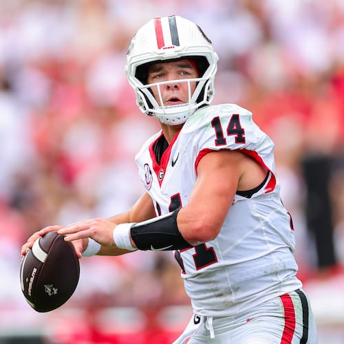 Georgia quarterback Gunner Stockton (14) looks to throw during the first half of an NCAA college football game against Western Kentucky, Saturday, Sept. 12, 2026, in Athens, Ga. (AP Photo/Colin Hubbard)